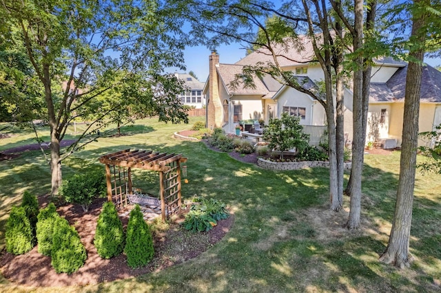 view of yard with a pergola and a patio