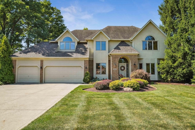 view of front of property with driveway, an attached garage, a shingled roof, a front lawn, and brick siding