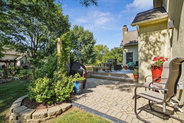 view of patio / terrace featuring a grill and a wooden deck