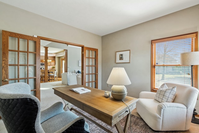 carpeted office featuring french doors