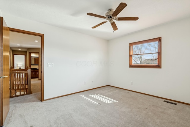 unfurnished room featuring visible vents, baseboards, carpet flooring, recessed lighting, and a ceiling fan