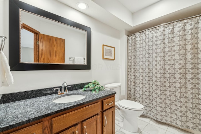 bathroom with tile patterned flooring, a shower with shower curtain, toilet, and vanity