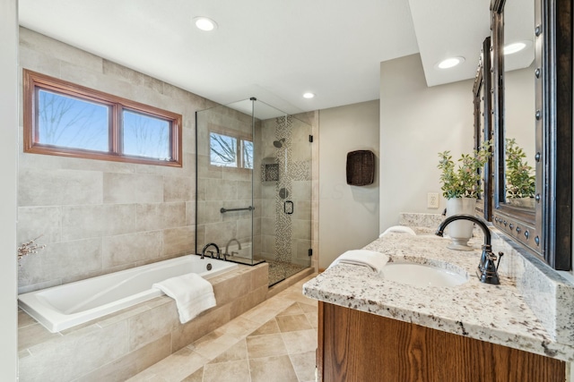 full bathroom with vanity, a garden tub, recessed lighting, and a stall shower