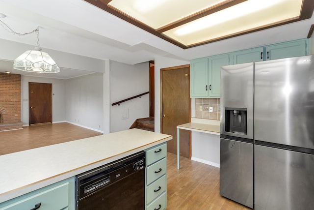 kitchen featuring decorative backsplash, stainless steel fridge, pendant lighting, light hardwood / wood-style flooring, and dishwasher