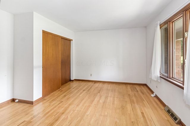 empty room with light wood-type flooring