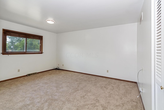 unfurnished bedroom with light colored carpet