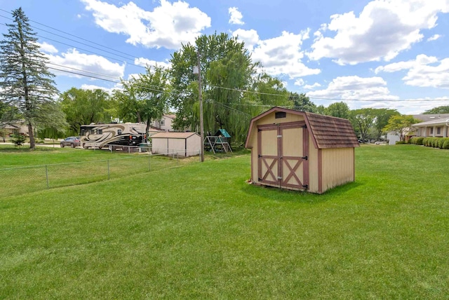 view of outdoor structure featuring a lawn