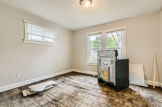 737 S Richardson Ave, Columbus, OH 43204 - unfurnished room featuring dark wood-style floors and a textured ceiling