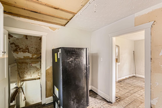 737 S Richardson Ave, Columbus, OH 43204 - kitchen with freestanding refrigerator and wood finished floors