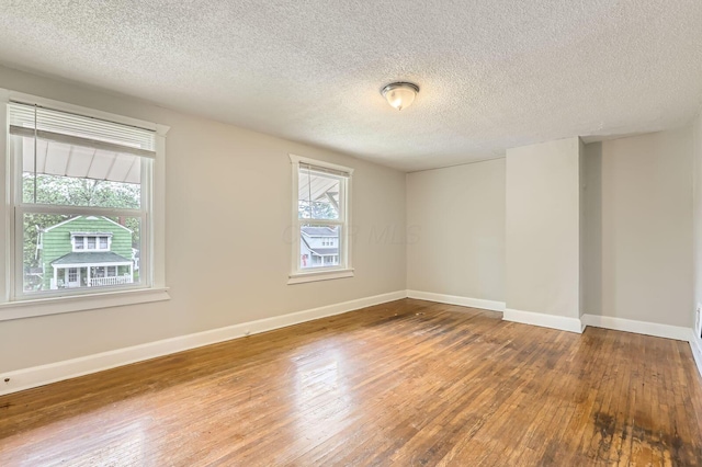 737 S Richardson Ave, Columbus, OH 43204 - empty room featuring wood-type flooring and a textured ceiling