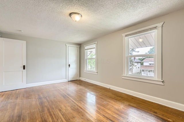 737 S Richardson Ave, Columbus, OH 43204 - unfurnished room with hardwood / wood-style flooring and a textured ceiling