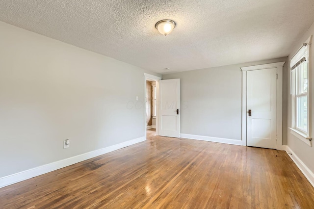 737 S Richardson Ave, Columbus, OH 43204 - empty room with hardwood / wood-style floors and a textured ceiling