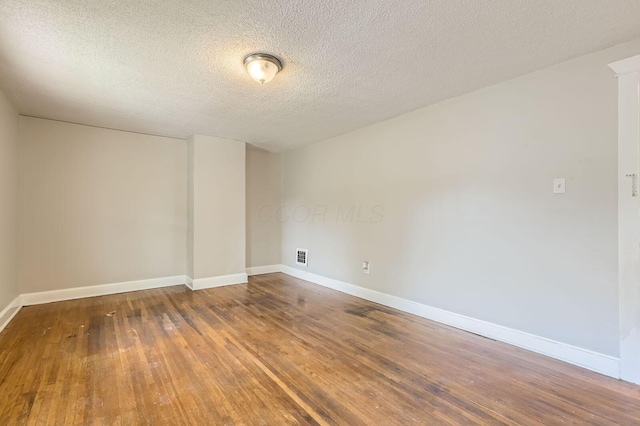 737 S Richardson Ave, Columbus, OH 43204 - unfurnished room with wood finished floors and a textured ceiling