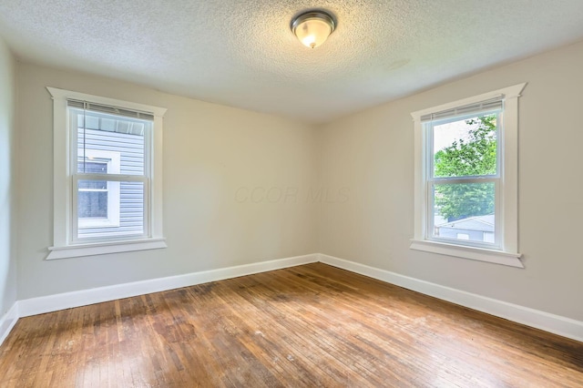 737 S Richardson Ave, Columbus, OH 43204 - unfurnished room with hardwood / wood-style floors and a textured ceiling