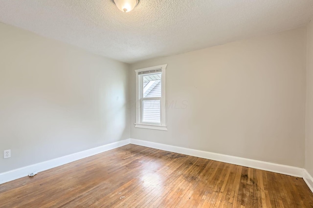 737 S Richardson Ave, Columbus, OH 43204 - empty room featuring hardwood / wood-style flooring and a textured ceiling
