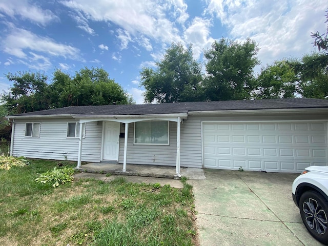 single story home featuring a garage