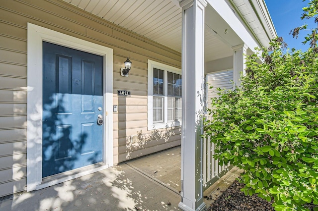 property entrance featuring covered porch