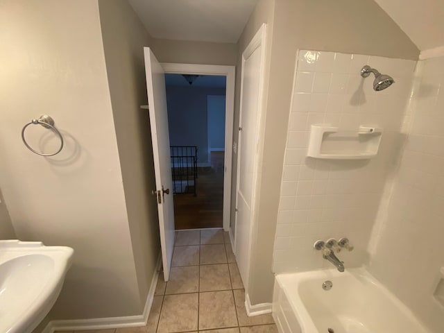 bathroom featuring tile patterned floors, sink, and bathing tub / shower combination