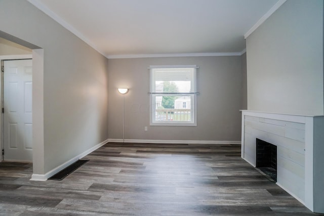 unfurnished living room with dark hardwood / wood-style floors and crown molding