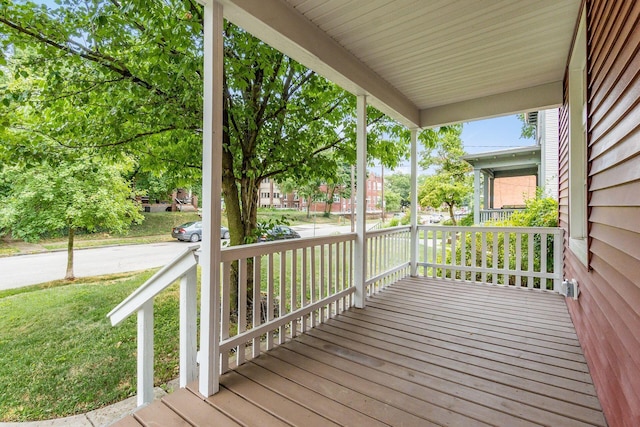 wooden terrace featuring covered porch