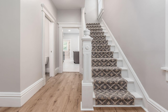 staircase featuring hardwood / wood-style flooring