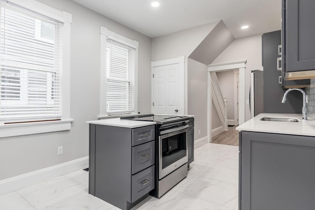 kitchen with gray cabinets, sink, and appliances with stainless steel finishes