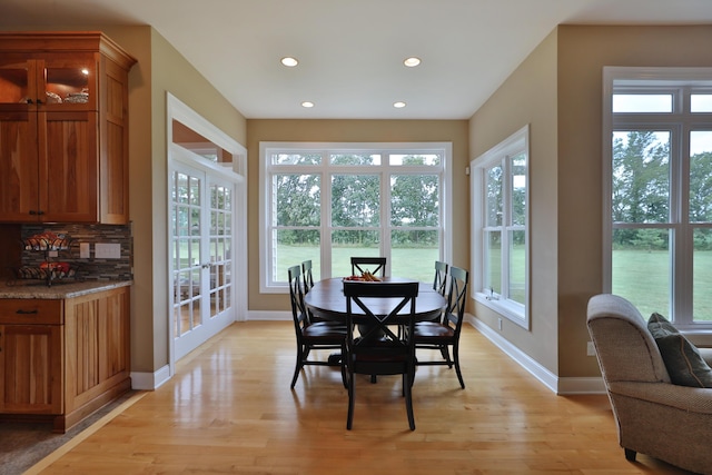 dining space featuring light hardwood / wood-style flooring and a wealth of natural light