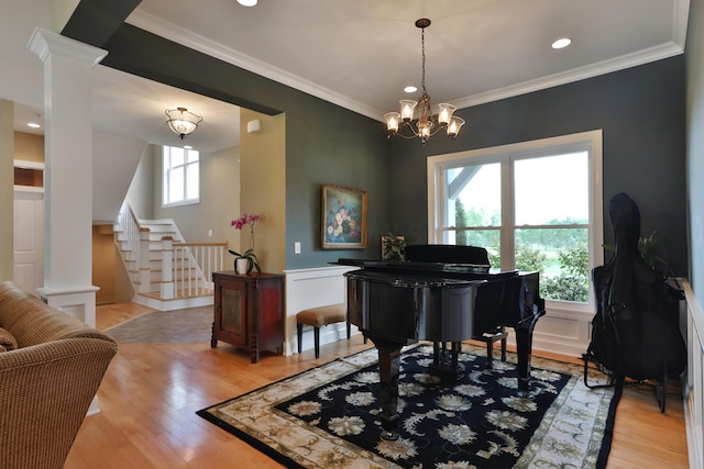 miscellaneous room featuring a wealth of natural light, light hardwood / wood-style flooring, and crown molding