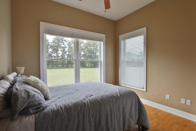 bedroom featuring hardwood / wood-style floors and ceiling fan