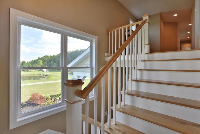 staircase with a wealth of natural light