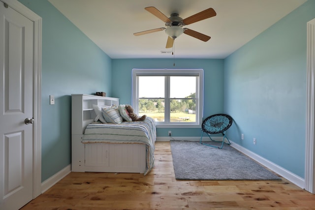 bedroom with ceiling fan and light hardwood / wood-style flooring