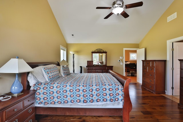 bedroom with ceiling fan, dark hardwood / wood-style flooring, and high vaulted ceiling