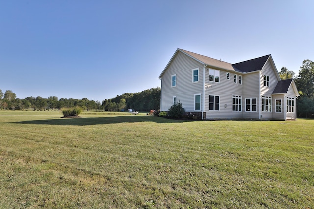 back of house featuring a yard