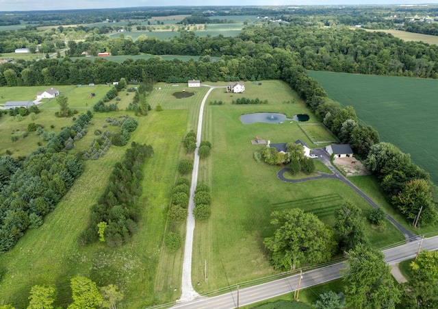 drone / aerial view featuring a rural view and a water view