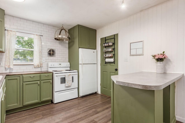 kitchen with backsplash, green cabinets, hardwood / wood-style floors, and white appliances