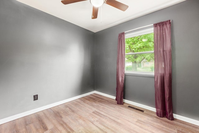 spare room featuring ceiling fan and light wood-type flooring