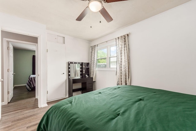 bedroom with ceiling fan and hardwood / wood-style flooring