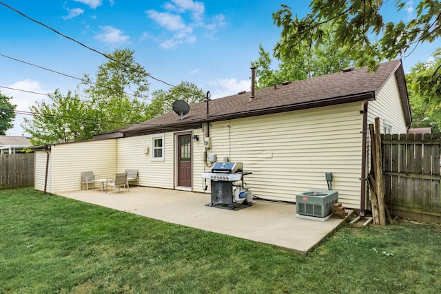 rear view of property with a patio area and a yard