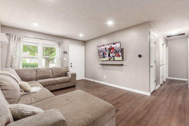 living room featuring dark wood-type flooring