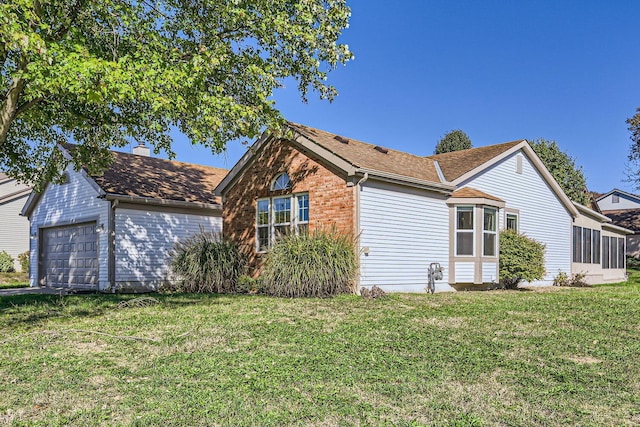 view of home's exterior featuring a yard and a garage