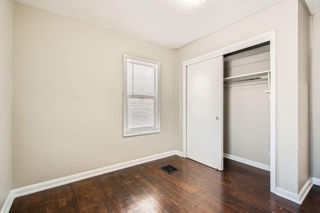 191 S Eureka Ave, Columbus, OH 43204 - unfurnished bedroom featuring wood-type flooring and a closet