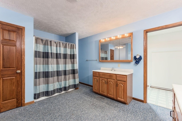 bathroom featuring vanity and a textured ceiling