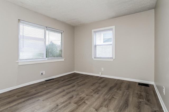 1328 Kent St, Columbus, OH 43205 - unfurnished room with dark wood-type flooring and baseboards