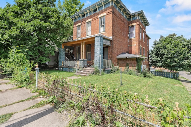 view of front of property with a porch and a front yard