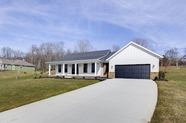 modern farmhouse style home featuring covered porch, a garage, driveway, board and batten siding, and a front yard