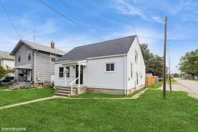 bungalow-style house with a front lawn