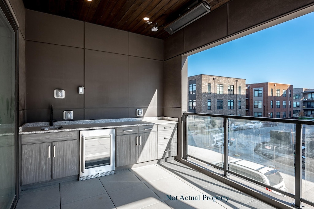 interior space featuring wine cooler and sink