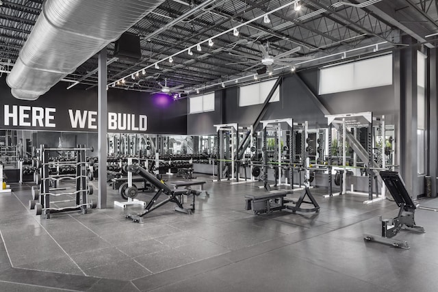 gym with a towering ceiling