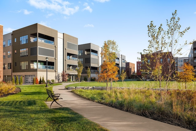 view of property's community with a lawn