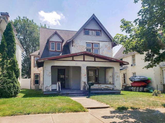 view of front of home featuring a porch and a front yard